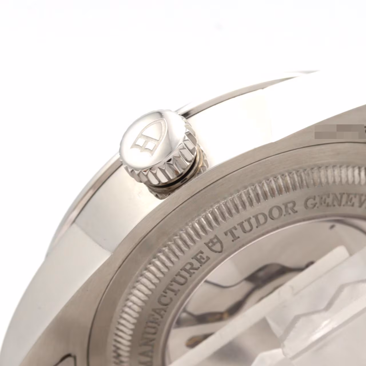 Steel watch with day and date apertures on the dial and a matching steel bracelet.