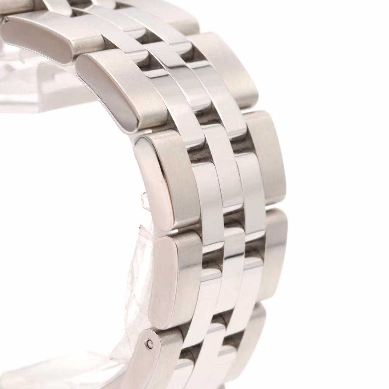 Steel watch with day and date apertures on the dial and a matching steel bracelet.