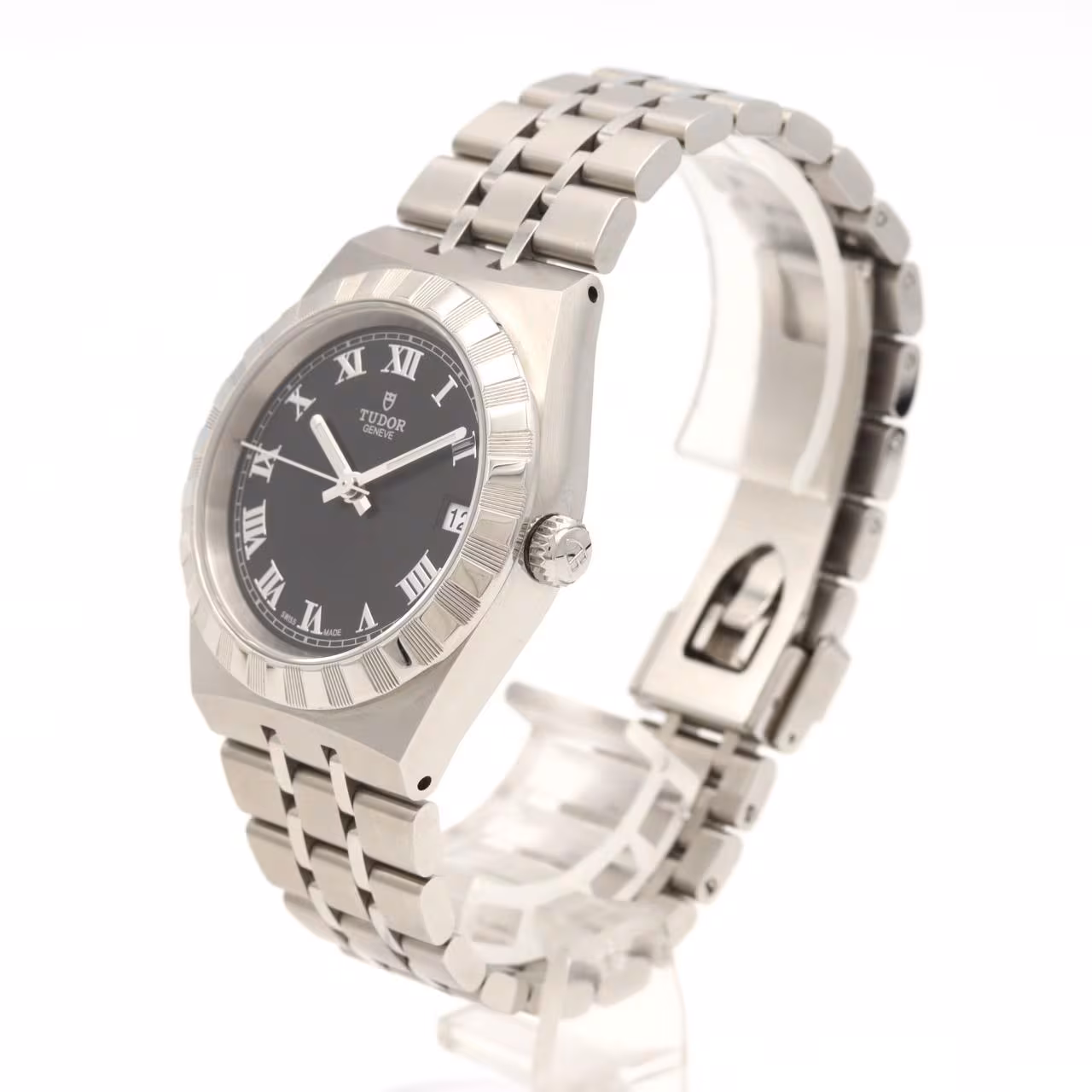 Stainless steel wristwatch with integrated bracelet and fluted bezel on a pale background.