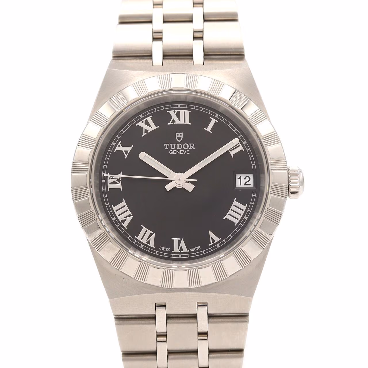 Stainless steel wristwatch with integrated bracelet and fluted bezel on a pale background.