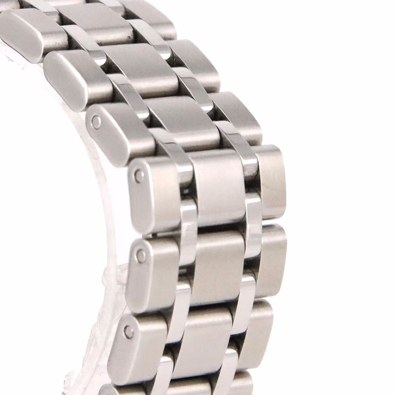 Stainless steel automatic wristwatch with an integrated bracelet and fluted bezel.